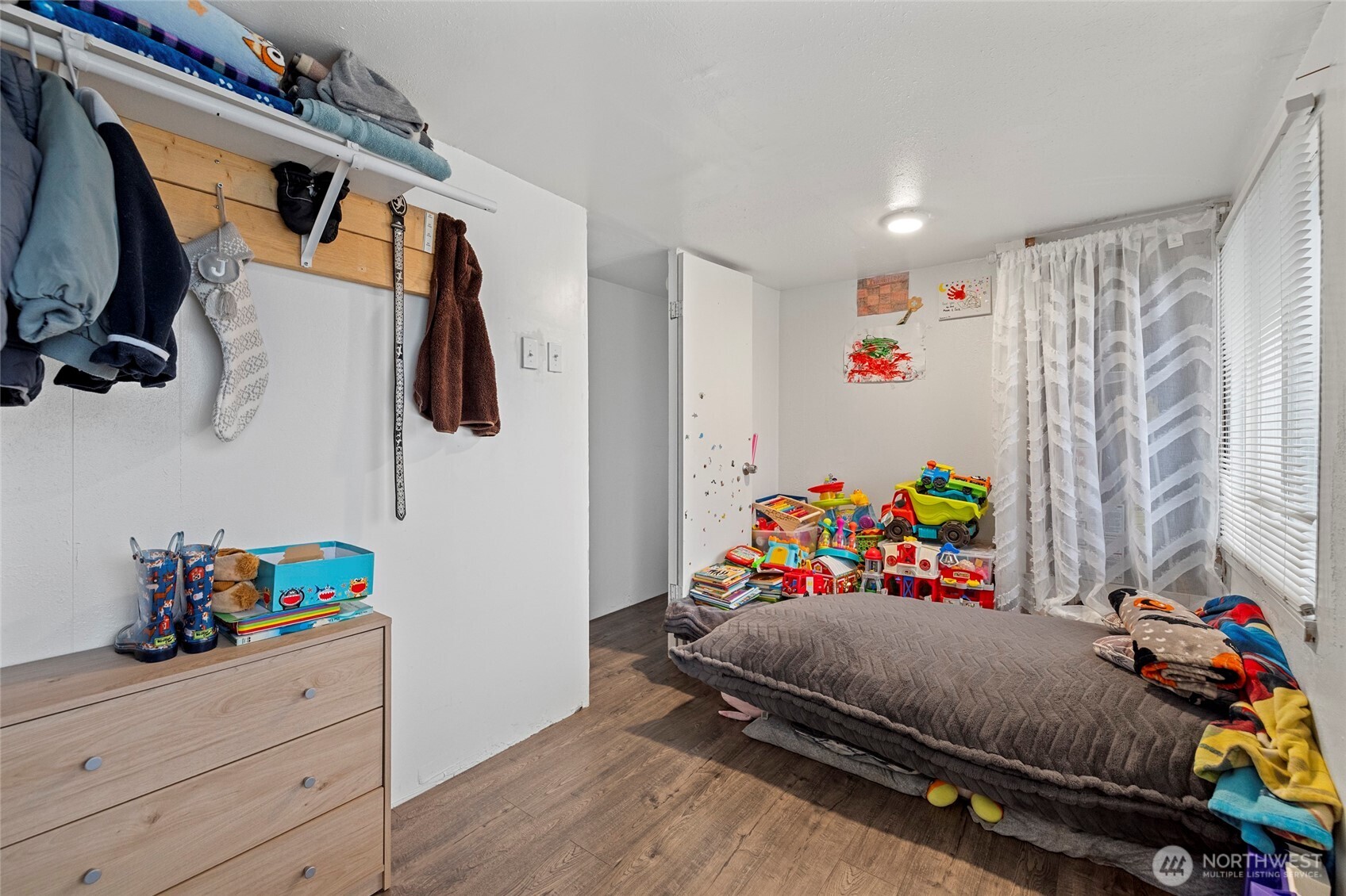 20420 Lafayette Road, Unit 11 Burlington, WA 98233 - Photo 10 of 14 a bed room with a bed and a couch