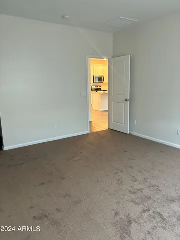 a view of an empty room and a window