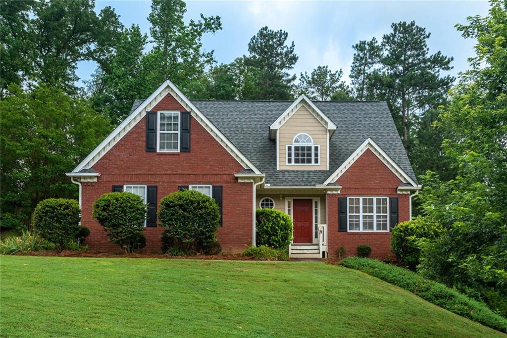 554 Ivey Way Southeast Mableton, GA 30126 - Photo 1 of 1 a front view of a house with a yard and garage
