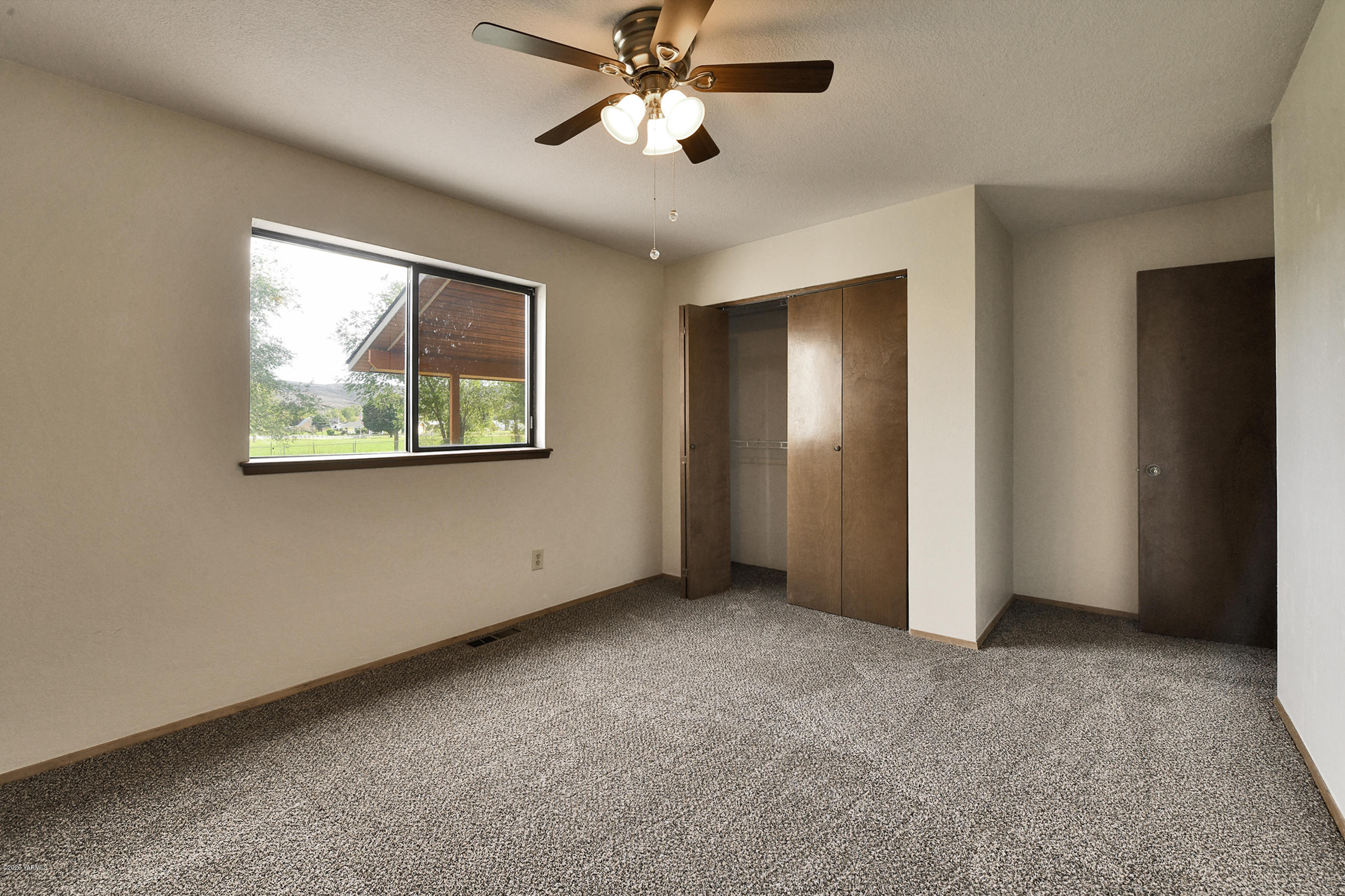 13010 Rutherford Road Yakima, WA 98903 - Photo 22 of 39 a view of an empty room with a window