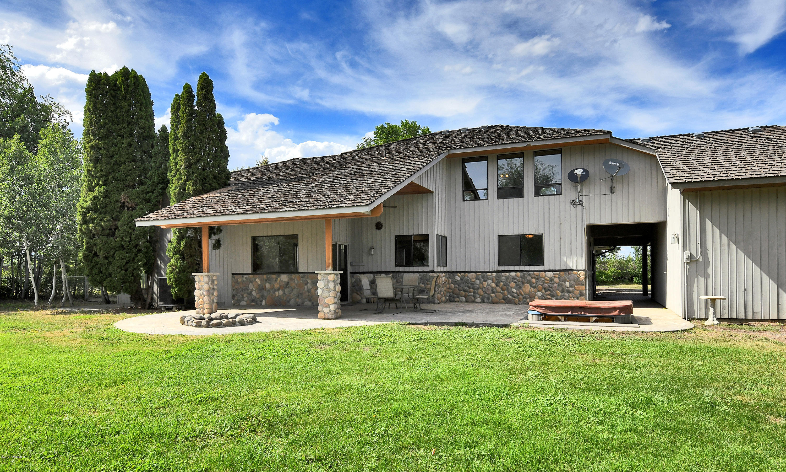13010 Rutherford Road Yakima, WA 98903 - Photo 28 of 39 a front view of house with outdoor seating and yard