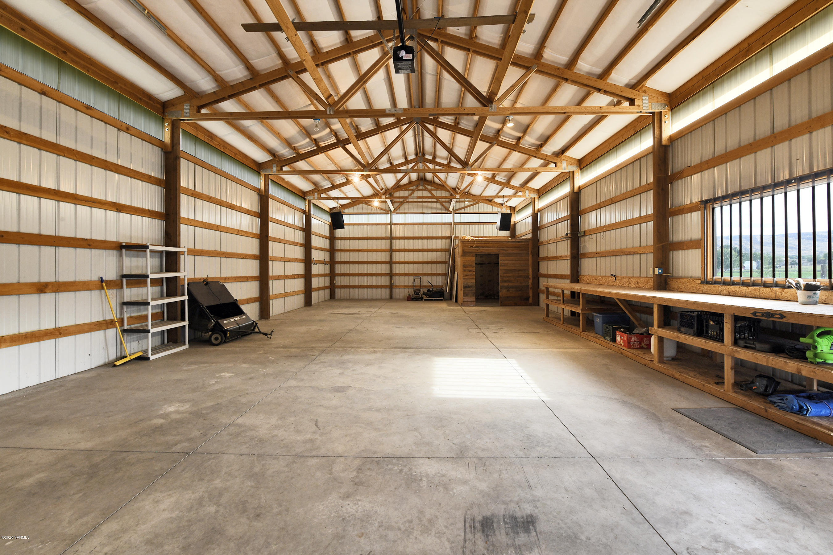 13010 Rutherford Road Yakima, WA 98903 - Photo 38 of 39 a view of a big room with furniture and a garage