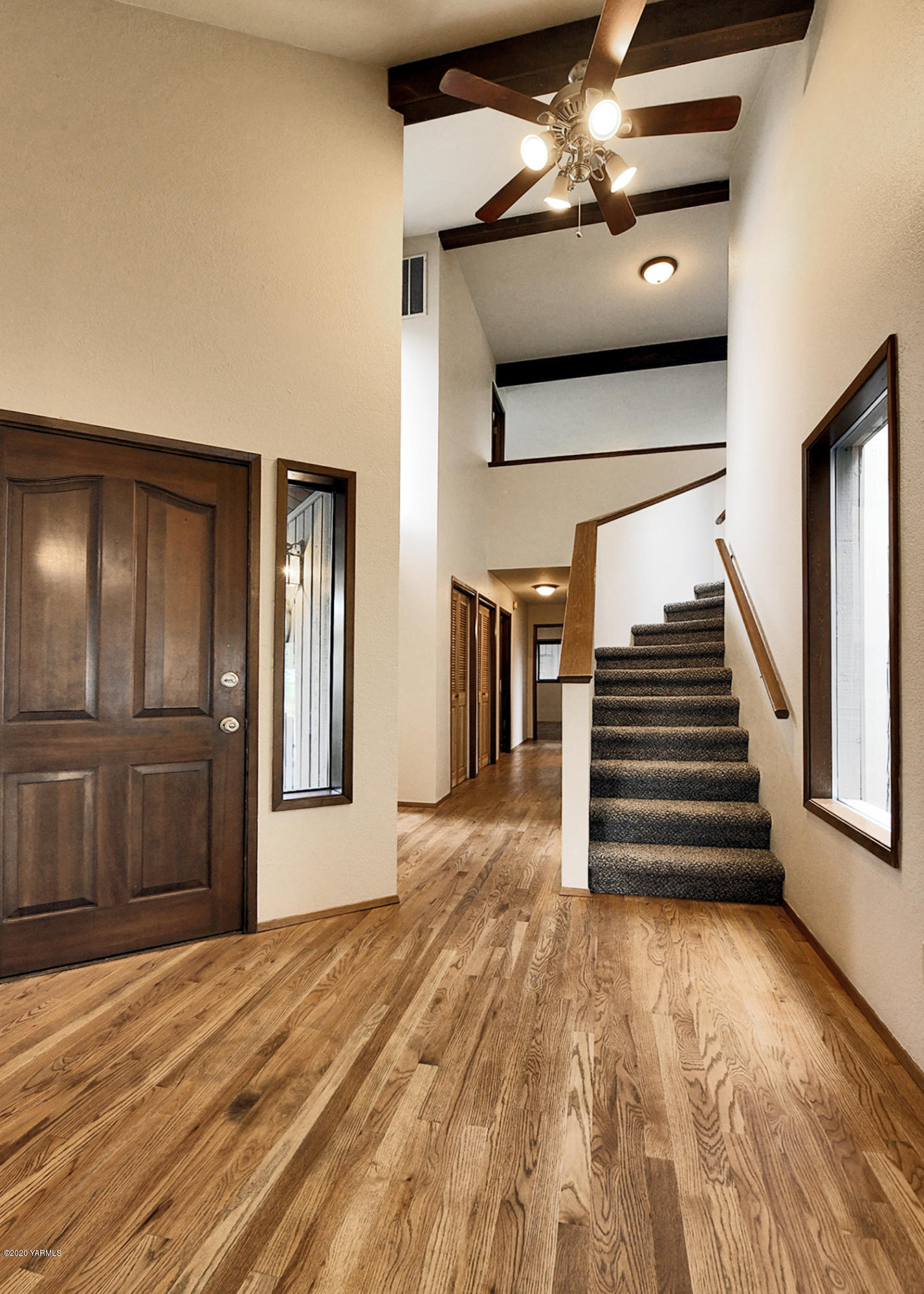 13010 Rutherford Road Yakima, WA 98903 - Photo 5 of 39 a view of a livingroom with wooden floor and stairs