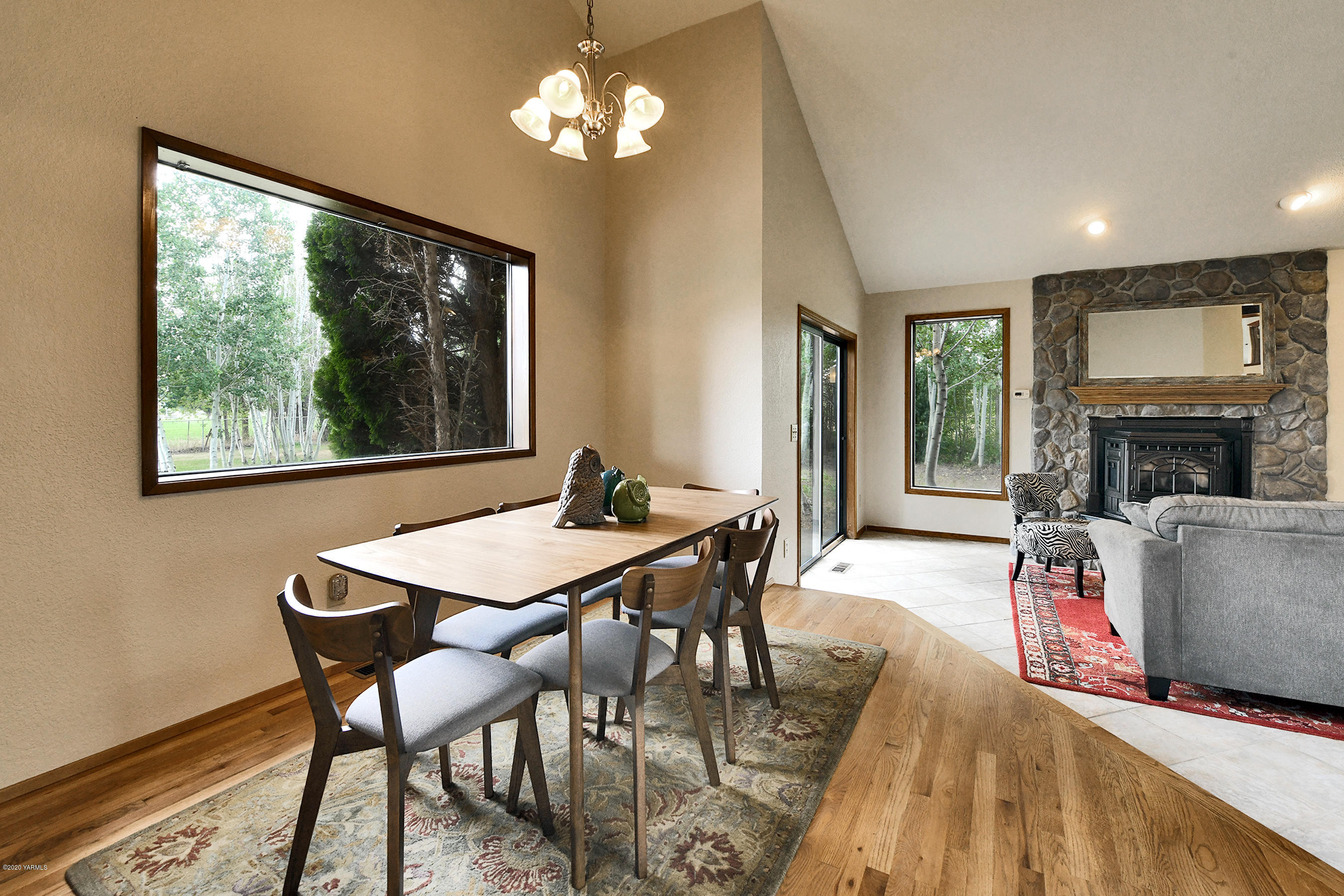 13010 Rutherford Road Yakima, WA 98903 - Photo 8 of 39 a view of a dining room with furniture window and wooden floor