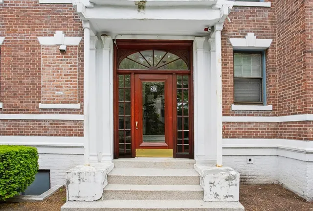 a front view of a house with a porch