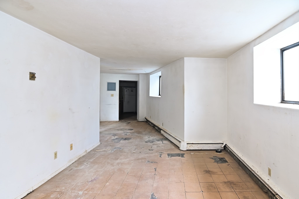 30 Kinross Road, Unit 1 Boston, MA 02135 - Photo 10 of 17 a view of an empty room with a window