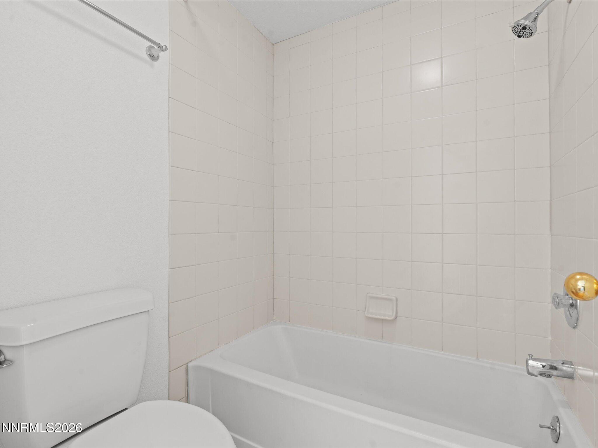 3170 Oakshire Court Reno, NV 89509 - Photo 35 of 43 a bathroom with a bathtub and toilet