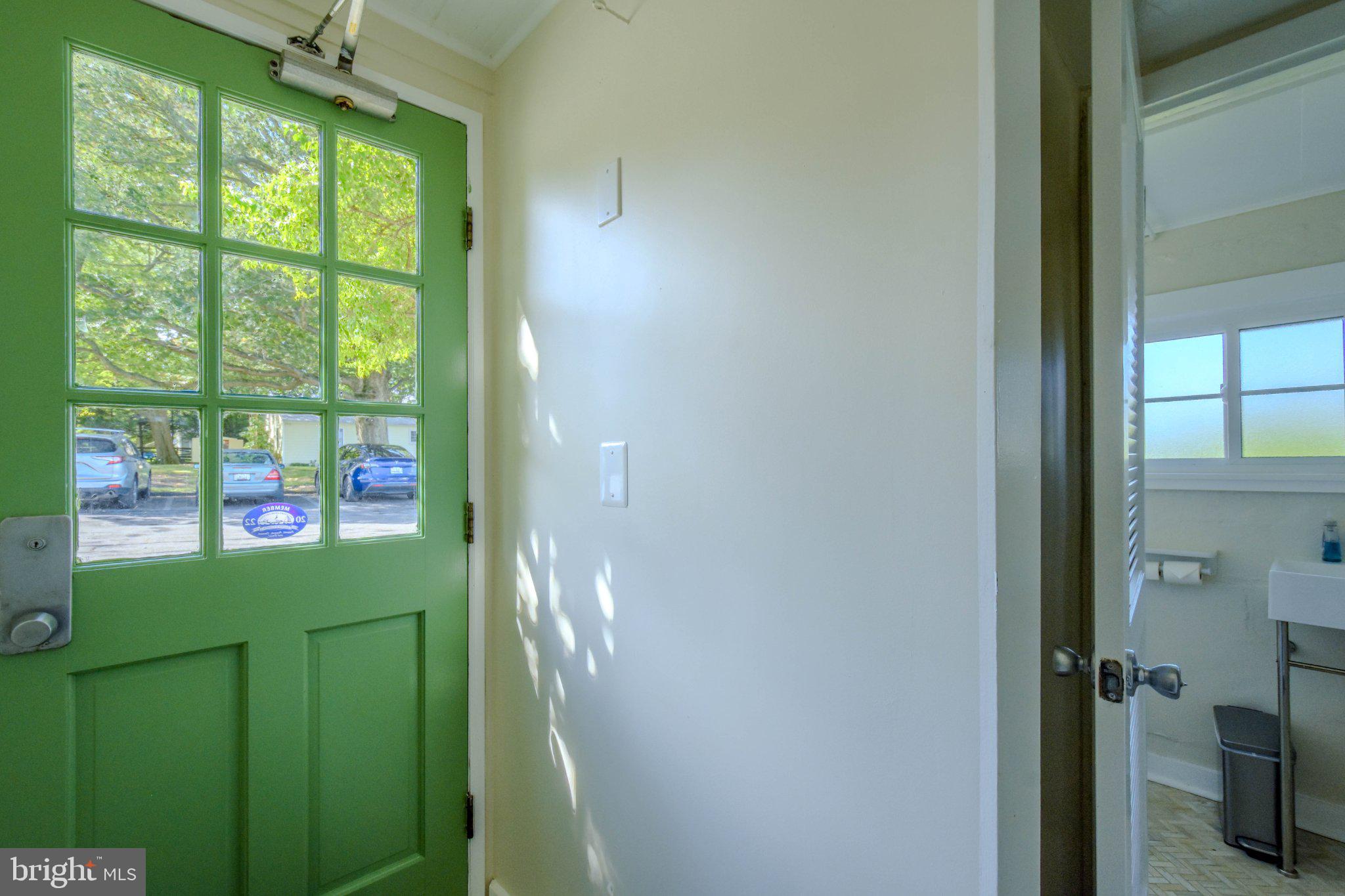 6062 Drum Point Road Deale, MD 20751 - Photo 14 of 17 Bright entryway with green door charm.