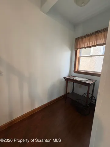 a bedroom with a bed and a chair