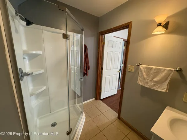 a bathroom with a shower and a toilet