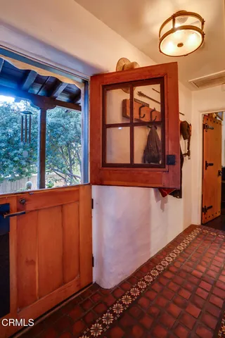a living room with fireplace furniture and a fireplace