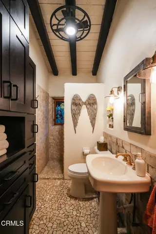 a view of a patio with table and chairs with wooden floor and fence
