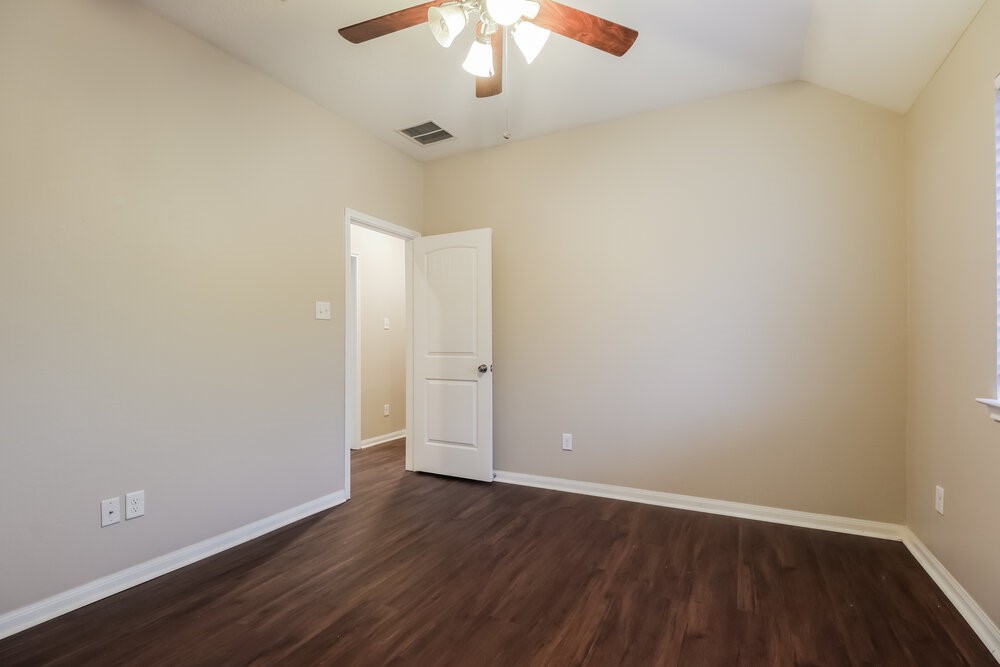 226 Fantasy Lane Montgomery, TX 77356 - Photo 14 of 17 wooden floor in an empty room