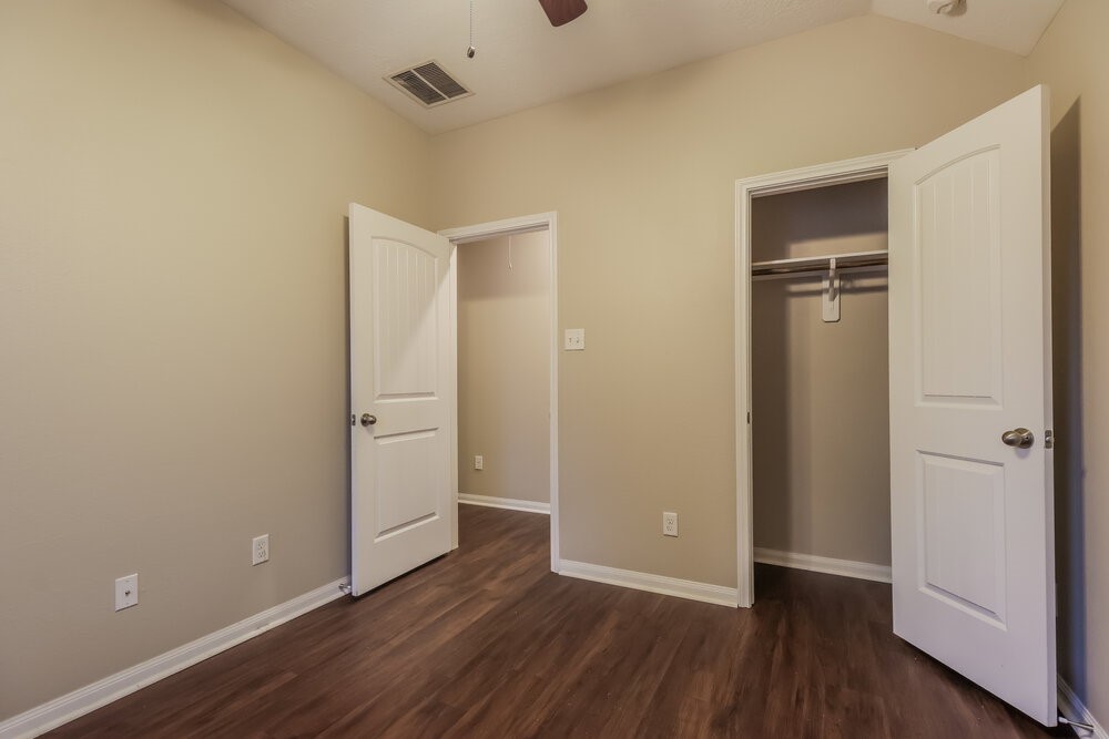 226 Fantasy Lane Montgomery, TX 77356 - Photo 15 of 17 a view of an empty room with wooden floor and closet