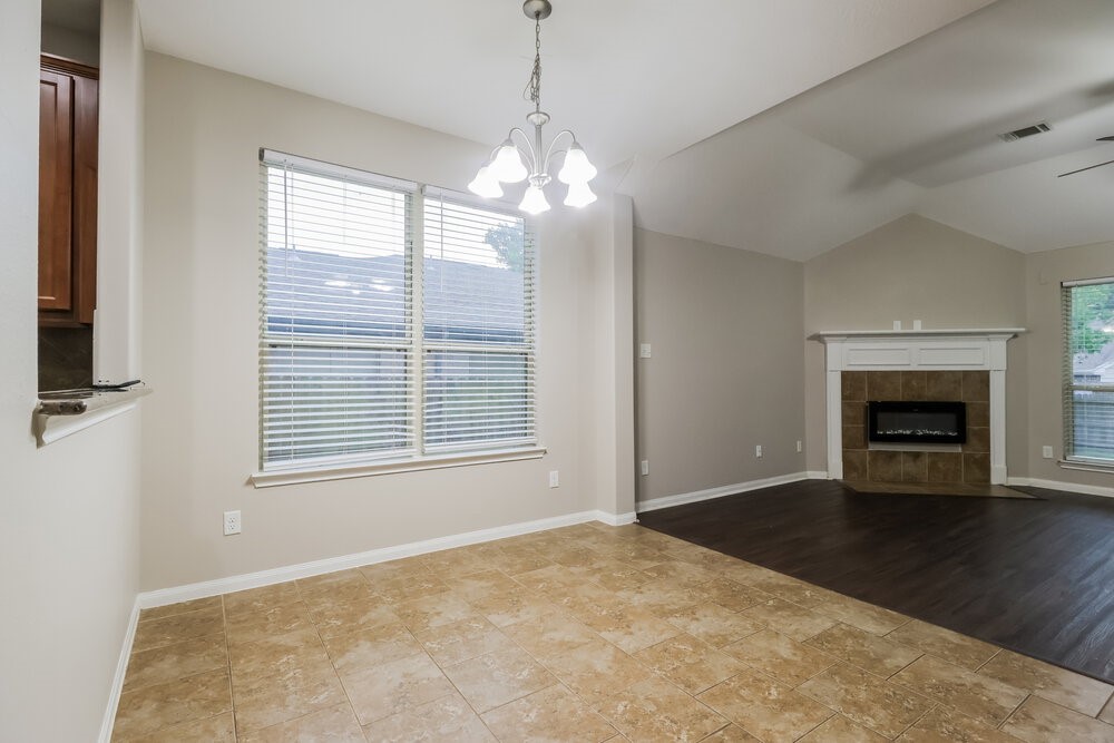 226 Fantasy Lane Montgomery, TX 77356 - Photo 6 of 17 a view of an empty room with a window and fireplace