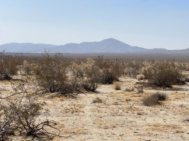a view of a town with mountains in the background