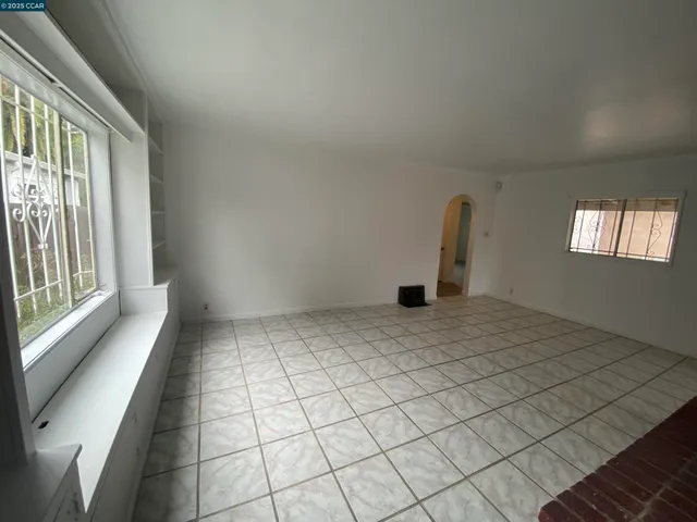 a view of empty room with windows