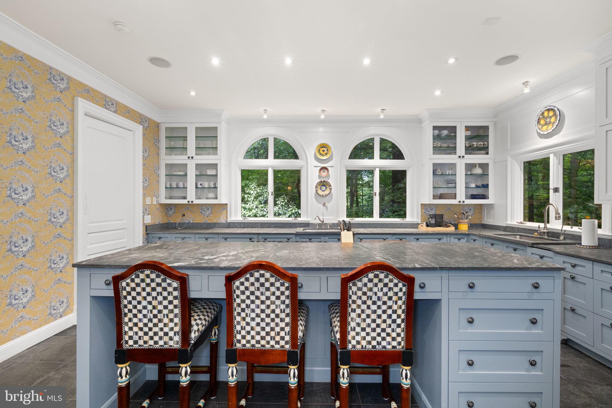 1111 Crest Lane McLean, VA 22101 - Photo 14 of 61 a dining hall with stainless steel appliances granite countertop a dining table and chairs with wooden floor