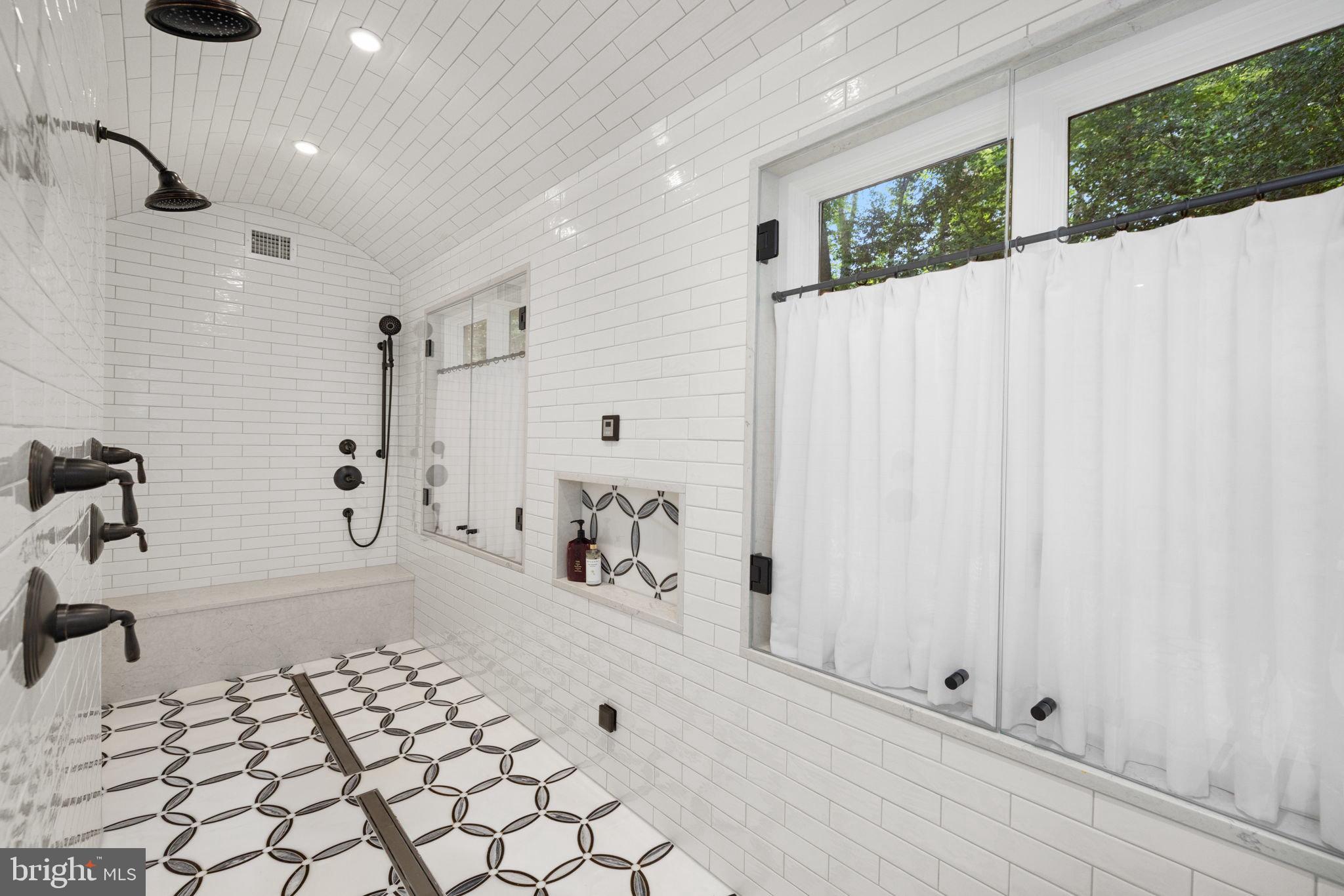 1111 Crest Lane McLean, VA 22101 - Photo 26 of 61 a bathroom with a bathtub and shower