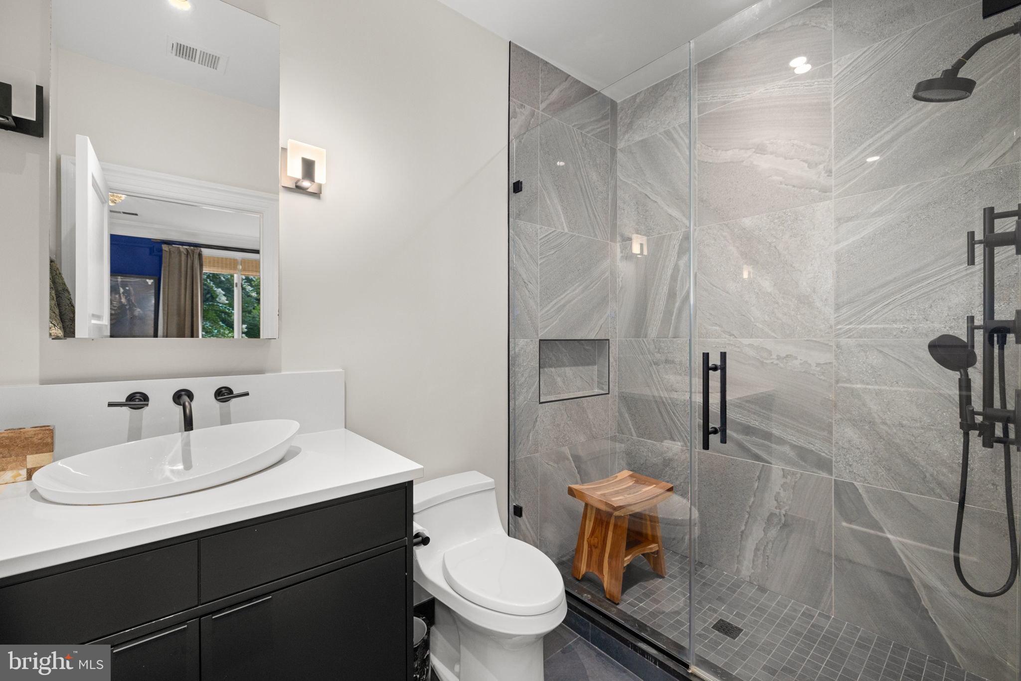 1111 Crest Lane McLean, VA 22101 - Photo 31 of 61 a bathroom with a sink toilet and shower