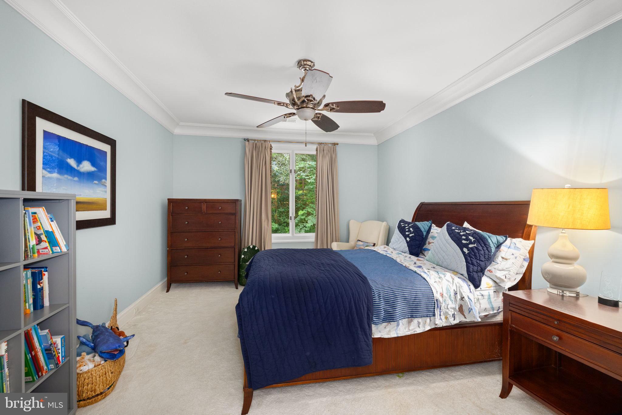 1111 Crest Lane McLean, VA 22101 - Photo 32 of 61 a bedroom with a bed and a book shelf