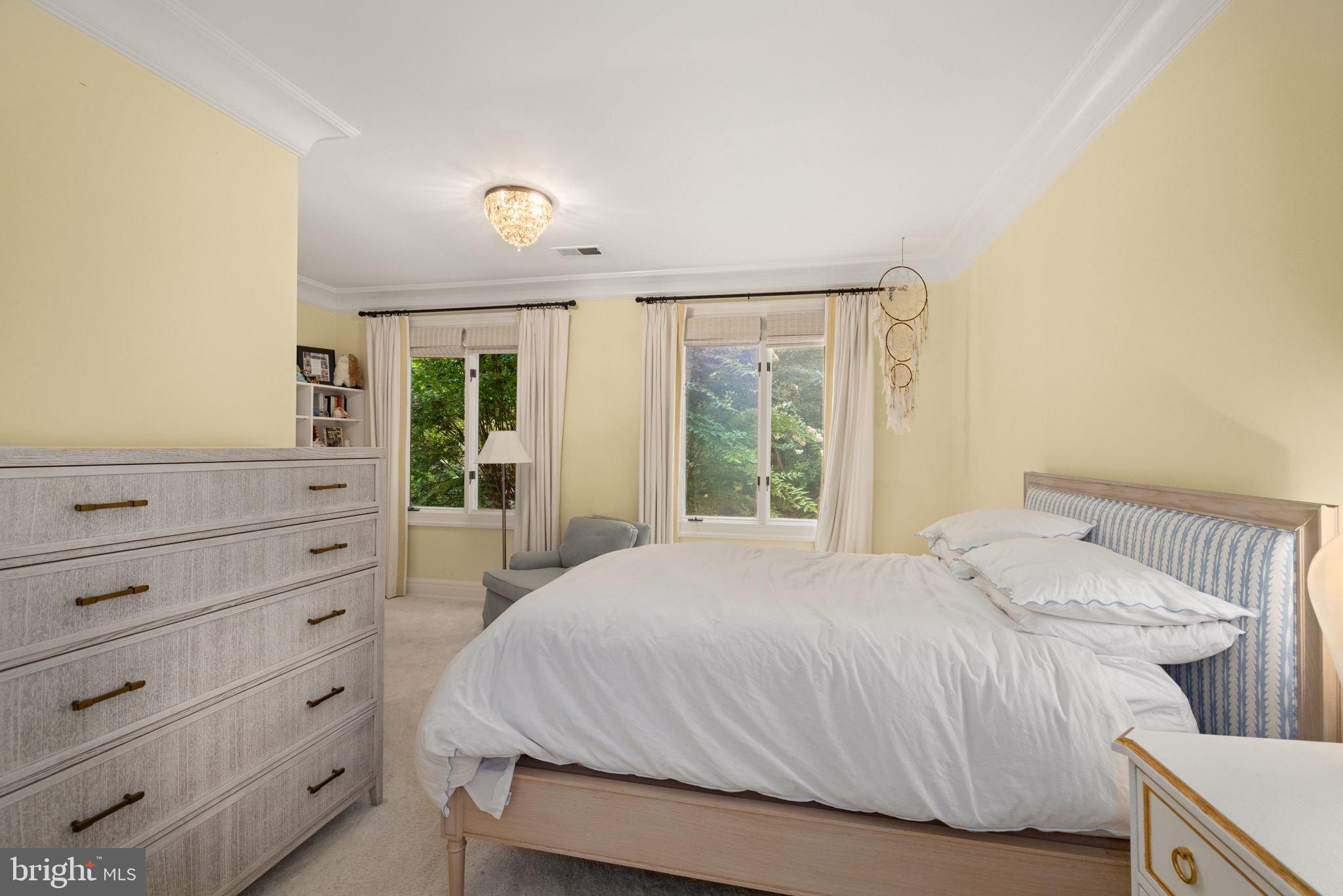 1111 Crest Lane McLean, VA 22101 - Photo 34 of 61 a bedroom with a bed and a dresser