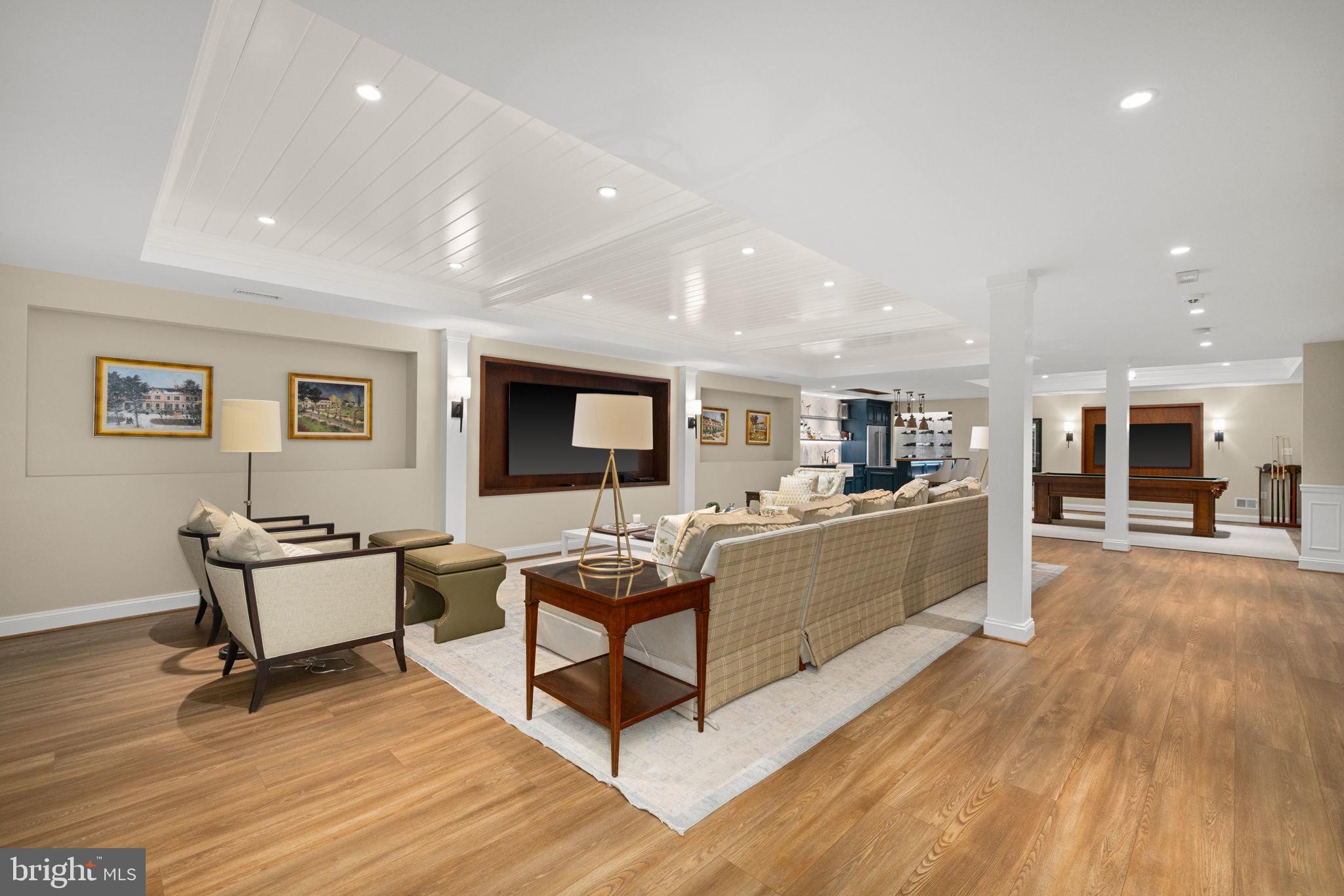 1111 Crest Lane McLean, VA 22101 - Photo 38 of 61 a living room with furniture and a wooden floor