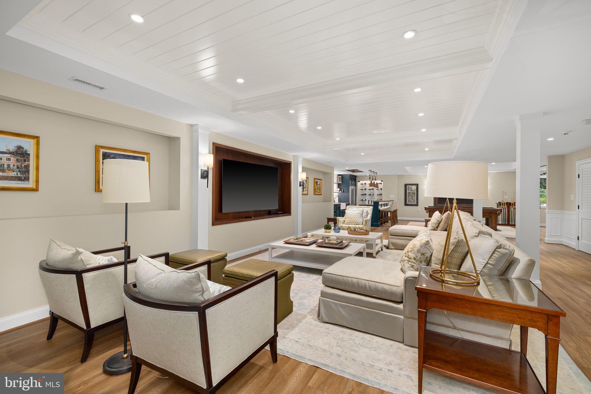 1111 Crest Lane McLean, VA 22101 - Photo 39 of 61 a living room with furniture wooden floor and a flat screen tv