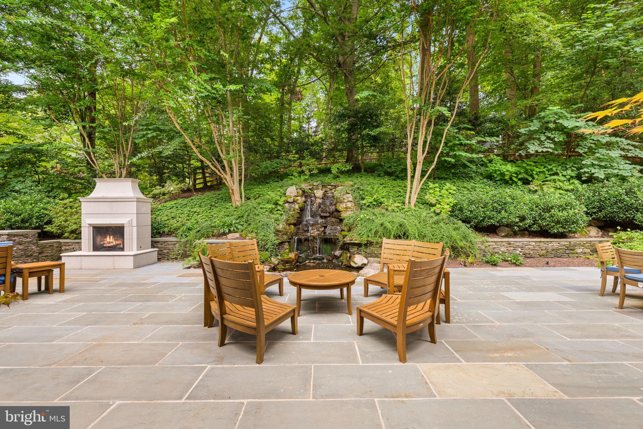 1111 Crest Lane McLean, VA 22101 - Photo 55 of 61 a backyard of a house with table and chairs