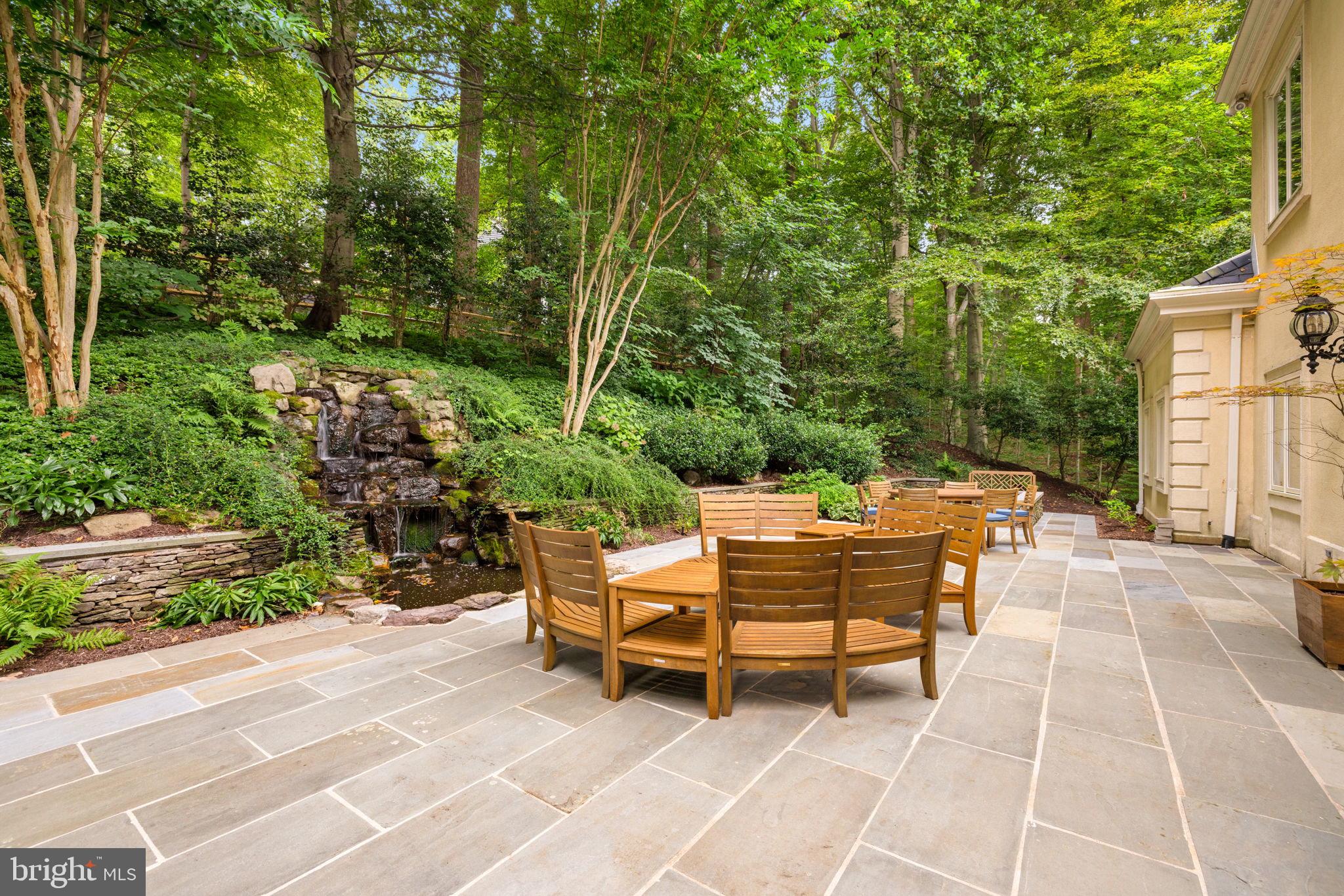 1111 Crest Lane McLean, VA 22101 - Photo 58 of 61 a backyard of a house with table and chairs