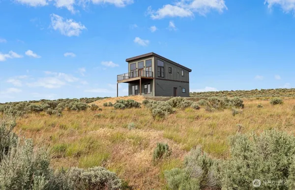 a house with a mountain in the background