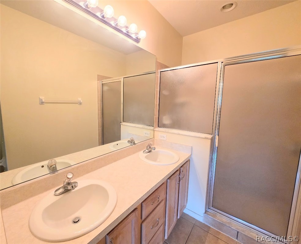 1600 West Spring Meadow Loop Lecanto, FL 34461 - Photo 19 of 28 a bathroom with a sink and a mirror