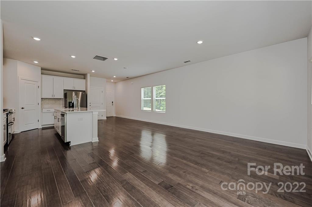 3534 Auburn Curb Road Charlotte, NC 28217 - Photo 3 of 11 a view of kitchen with wooden floor and window
