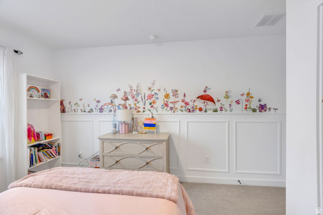 3452 Mapleton Hts Drive Mapleton, UT 84664 - Photo 21 of 40 White paneled accent wall with decorative elements, light-toned carpeting, and a built-in shelving unit