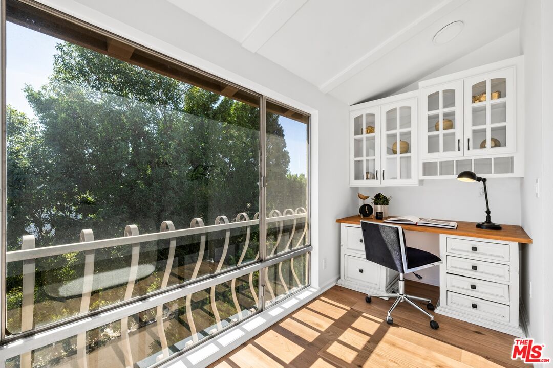 12720 Burbank Boulevard, Unit 318 Valley Village, CA 91607 - Photo 5 of 12 a view of a bedroom with furniture and windows