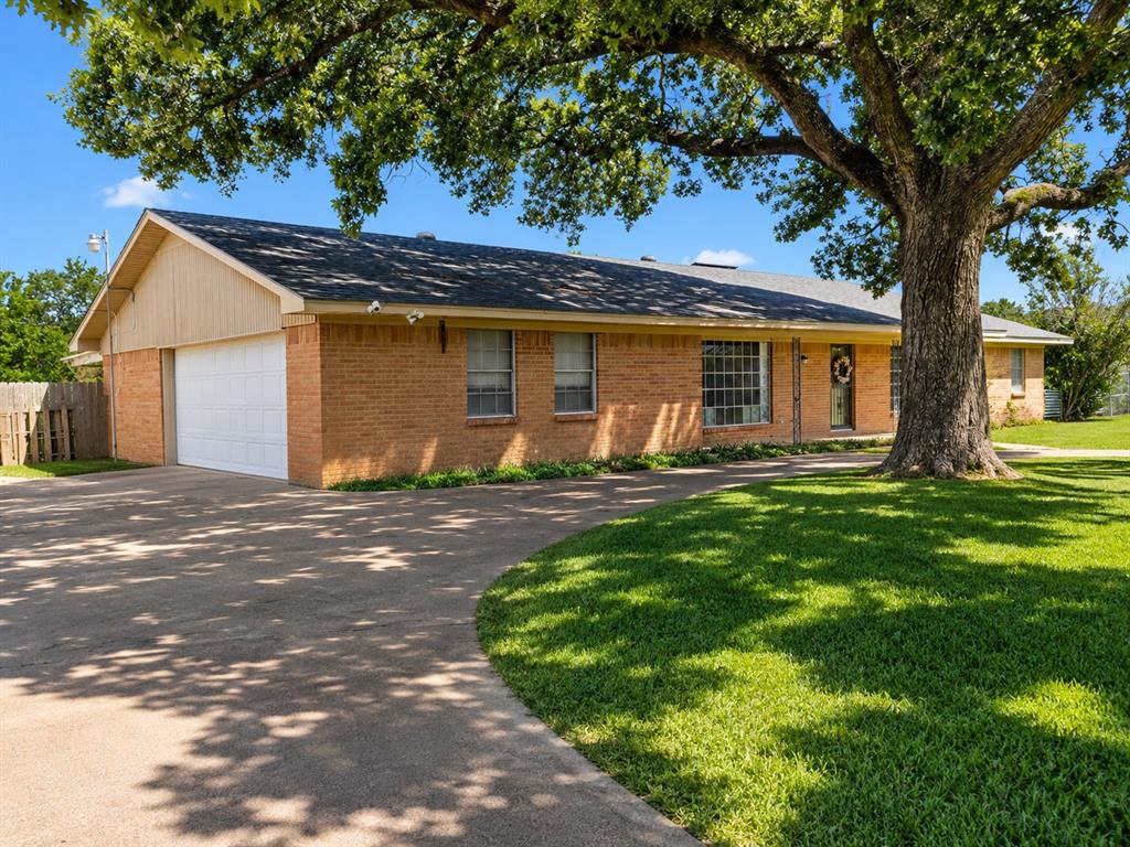 1081 Wright Street Terrell, TX 75160 - Photo 1 of 29 Brick ranch-style exterior with an attached two-car garage