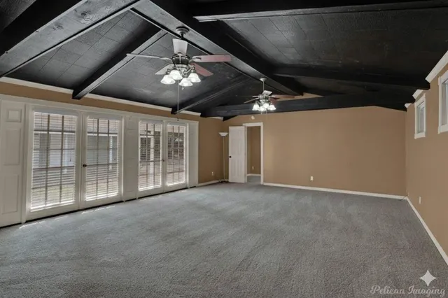 a view of an empty room with a projector