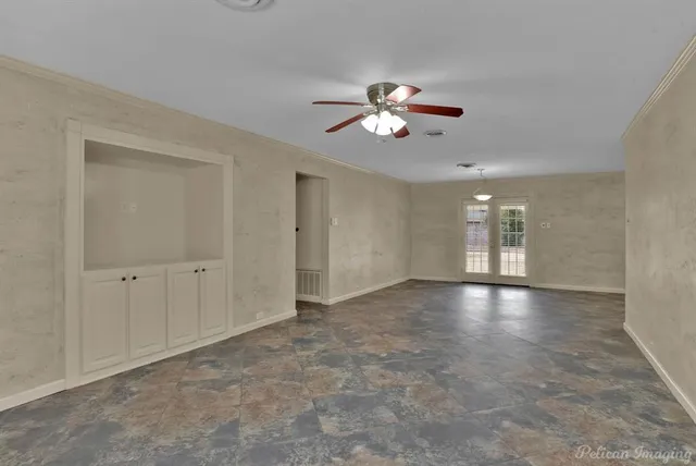 a view of empty room with windows