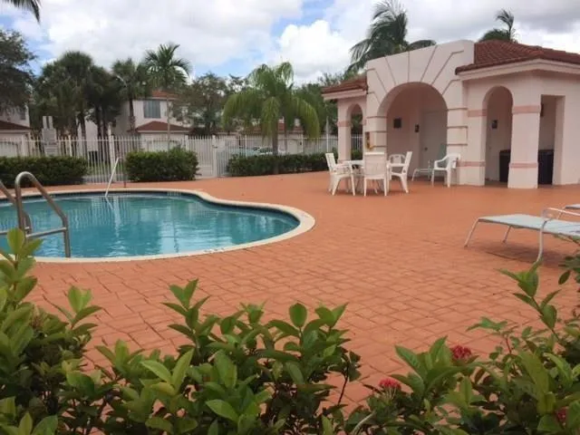 a view of a swimming pool with a patio