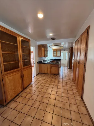 a kitchen with stainless steel appliances a refrigerator and microwave