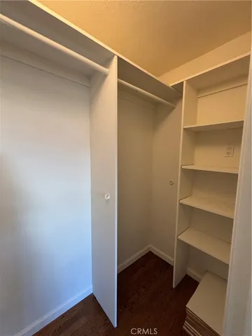 a view of an empty walk in closet