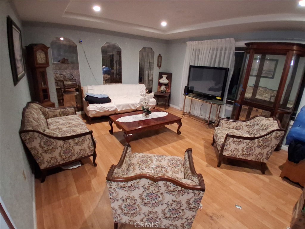 a living room with furniture fireplace and a flat screen tv