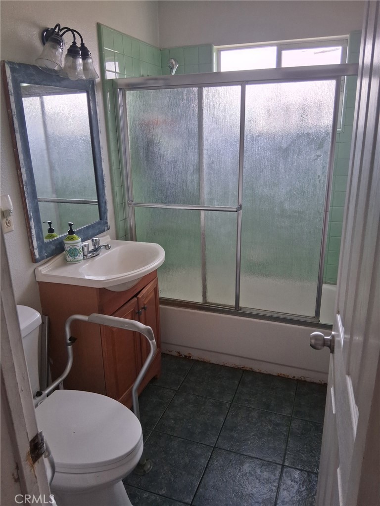 3631 La Costa Place Oxnard, CA 93033 - Photo 6 of 11 a bathroom with a sink a toilet a mirror and shower