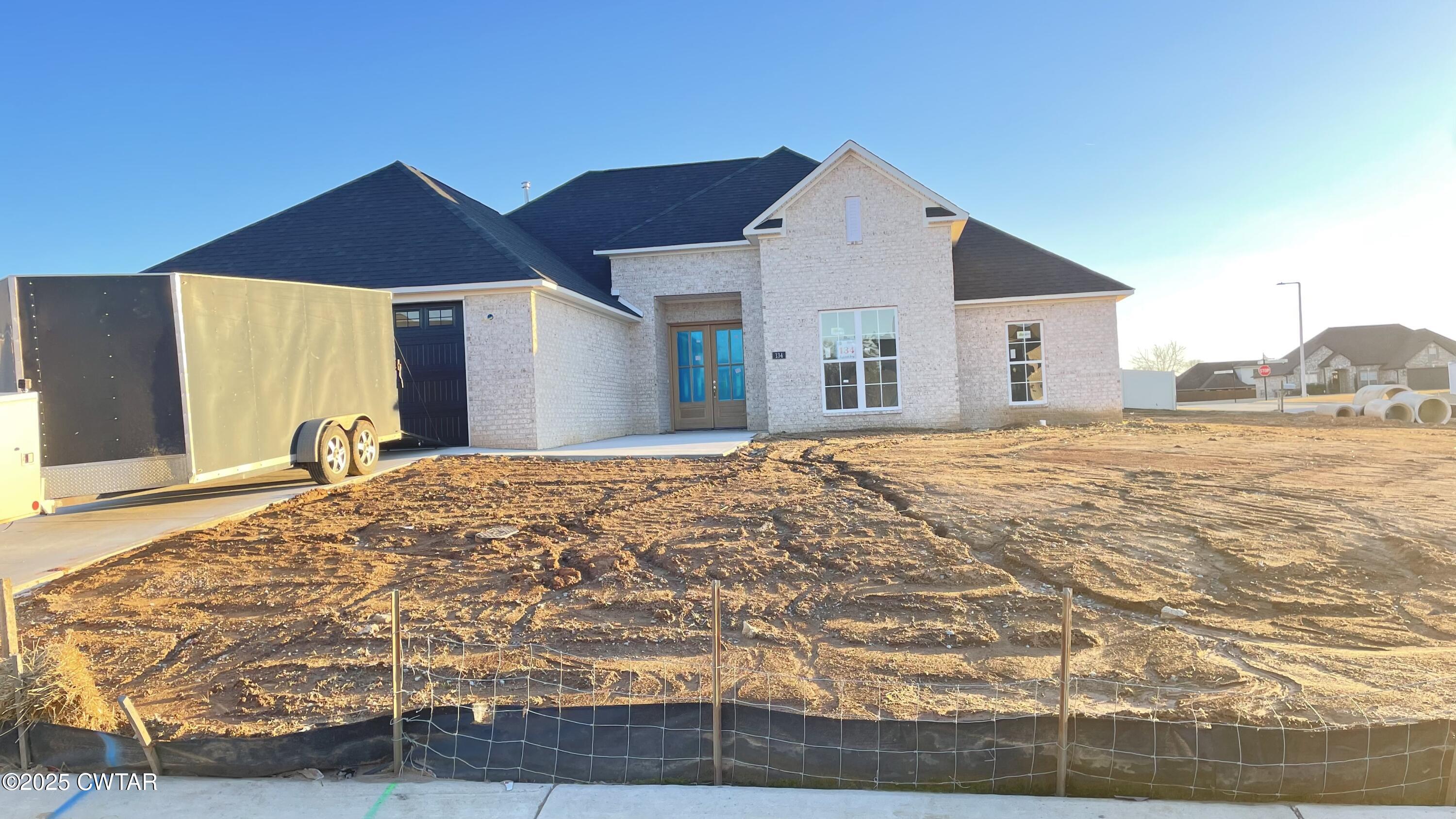 134 Daybreak Loop Medina, TN 38355 - Photo 5 of 6 a view of a house with a yard
