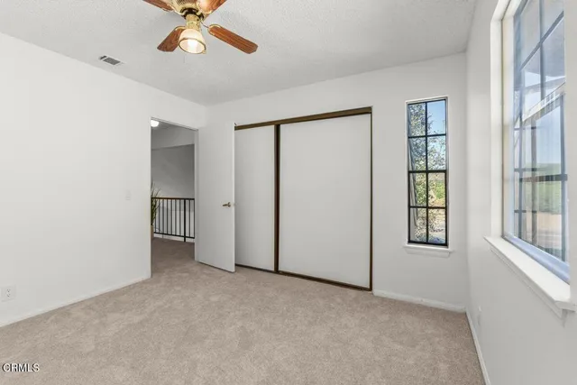 a view of kitchen with sink and cabinets