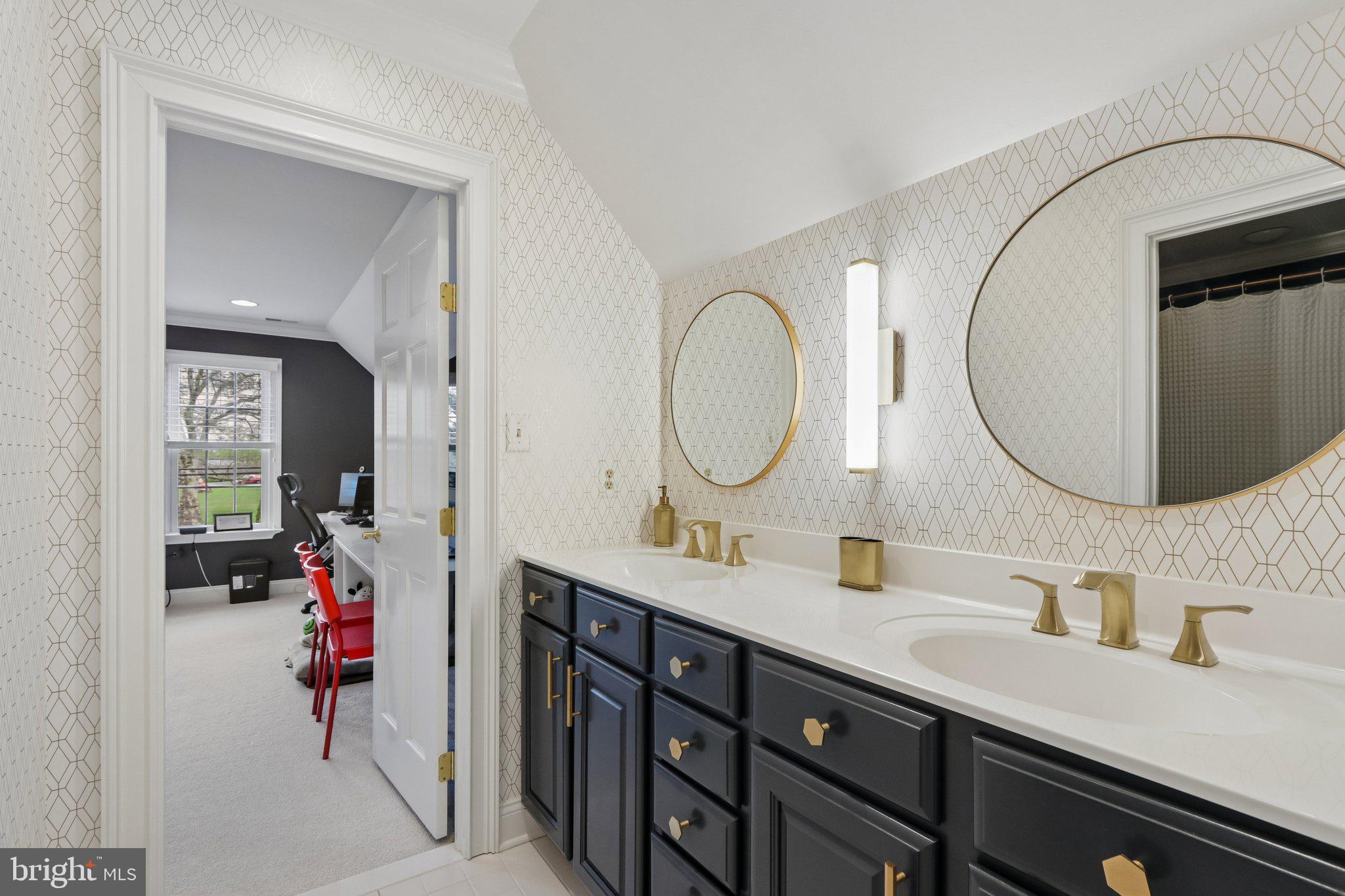 209 Welsh Road Ambler, PA 19002 - Photo 57 of 80 a bathroom with a double vanity sink mirror and a mirror