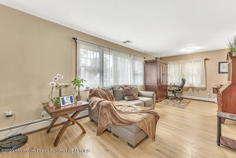 84 Ravine Drive Matawan, NJ 07747 - Photo 9 of 27 a living room with furniture and a large window