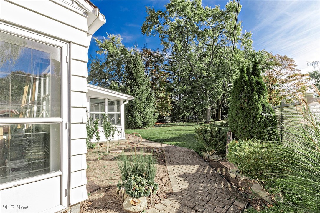 1691 Harwich Road Lyndhurst, OH 44124 - Photo 36 of 45 View of green lawn with an enclosed porch.