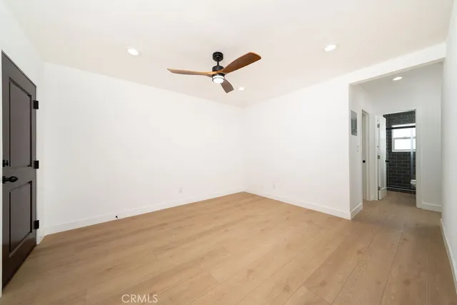 a view of a room with a sink and wooden floor