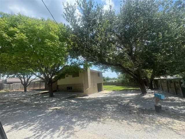 a view of a house with a tree and a tree